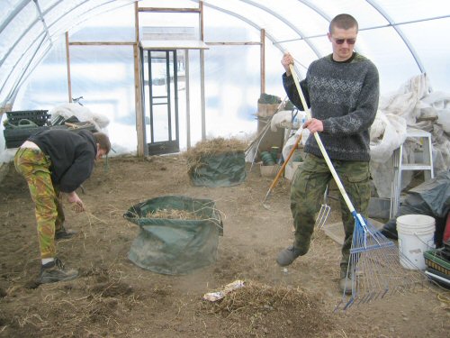 Volunteers clean greenhouse