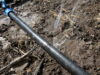 Water spurting from leak in drip tape